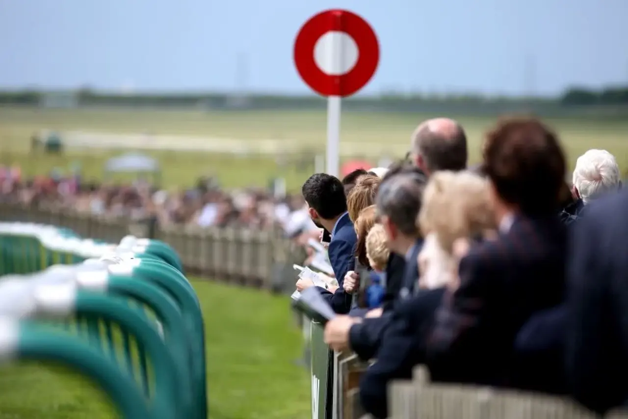 Racegoers By The Finishing Post At The Adnams July Course